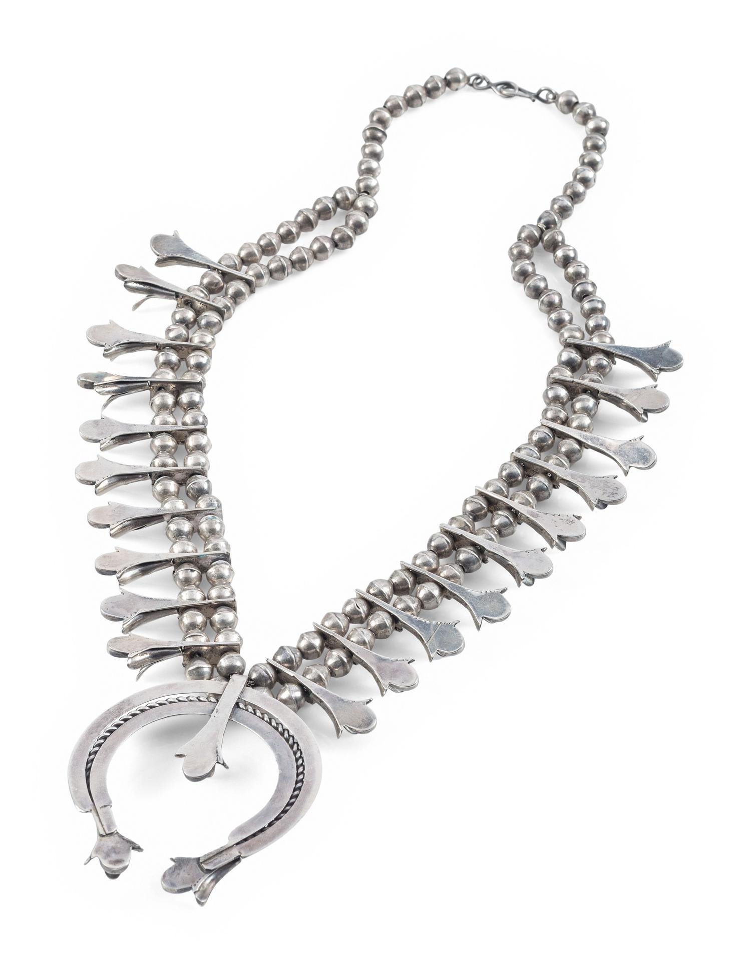 A Navajo Silver and Turquoise Squash Blossom Necklace