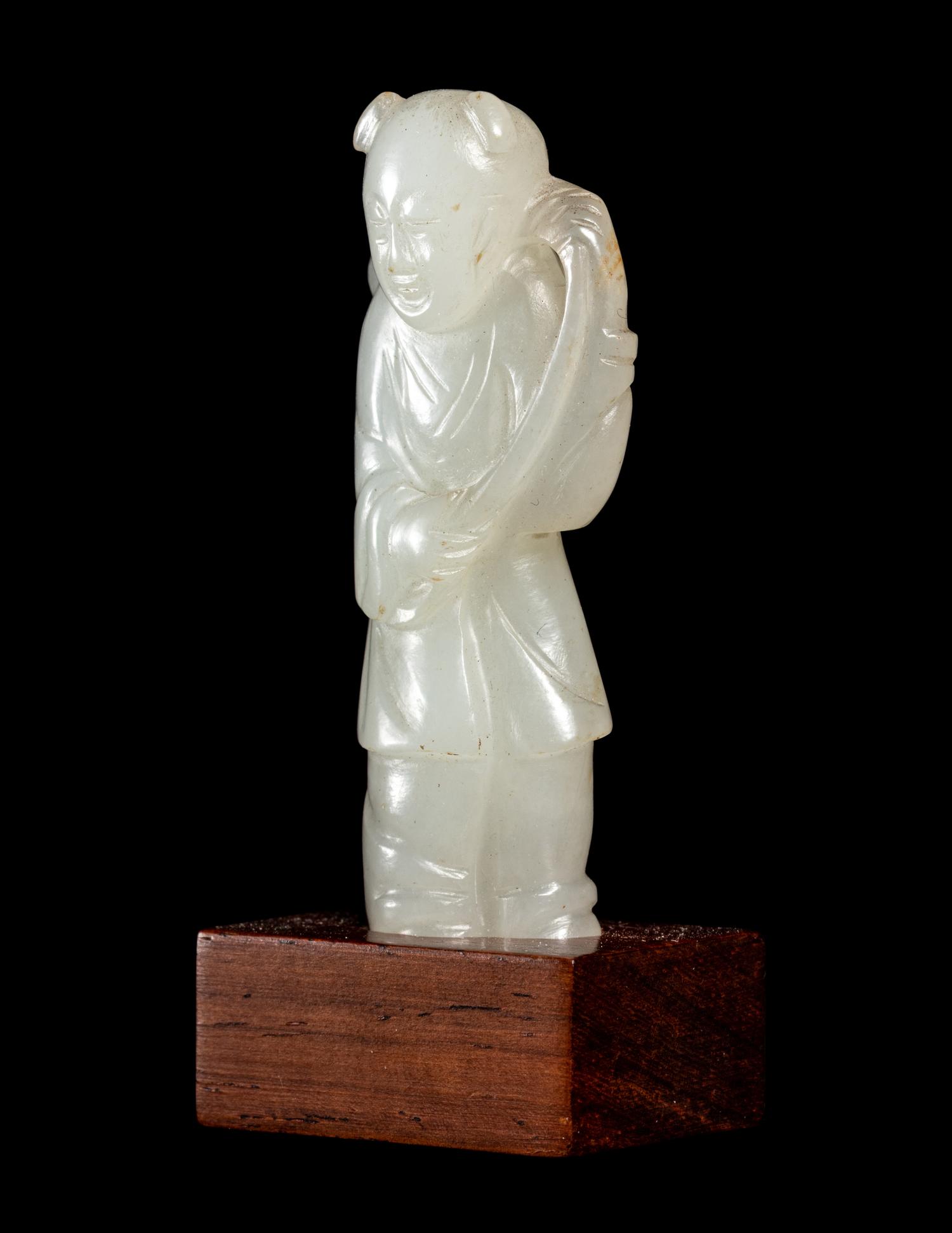 Two Carved Pale Celadon Jade Figures