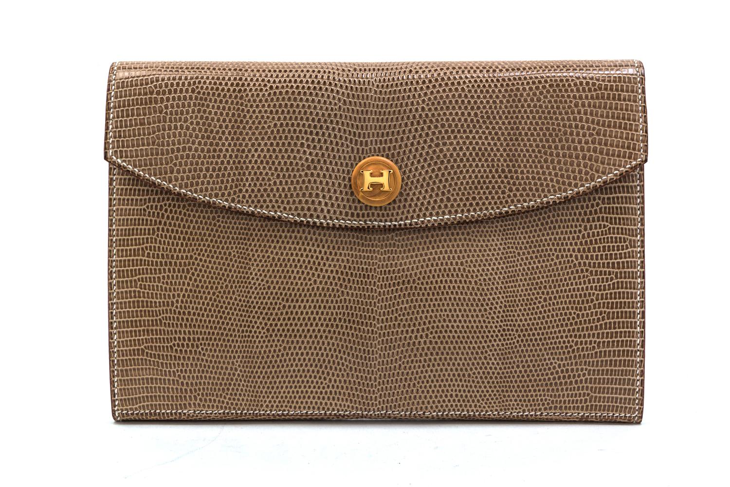 An Hermes Taupe Lizardskin Rio Clutch, 9 1/2 x 6 1/2 x 1 inches.