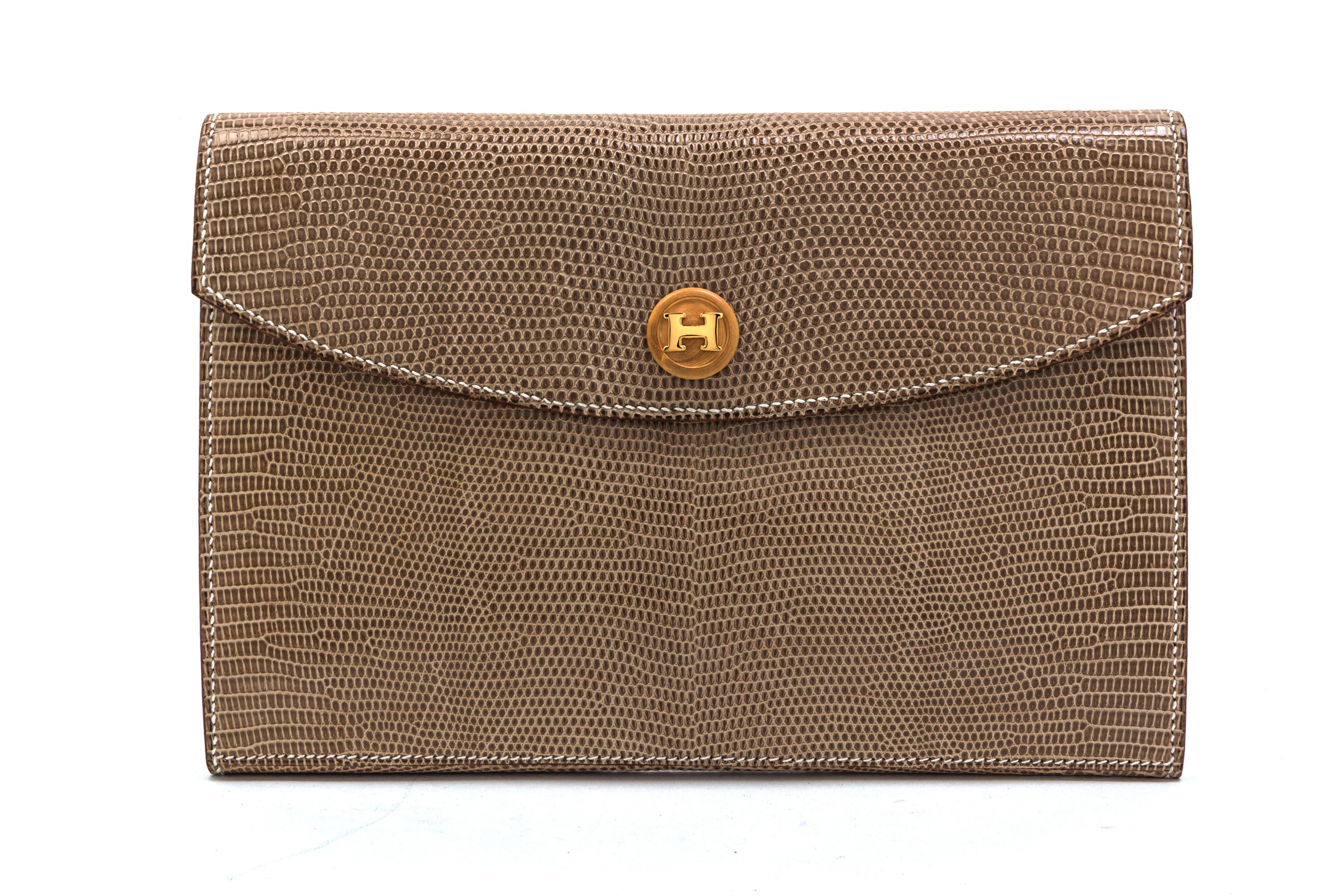 An Hermes Taupe Lizardskin Rio Clutch, 9 1/2 x 6 1/2 x 1 inches.