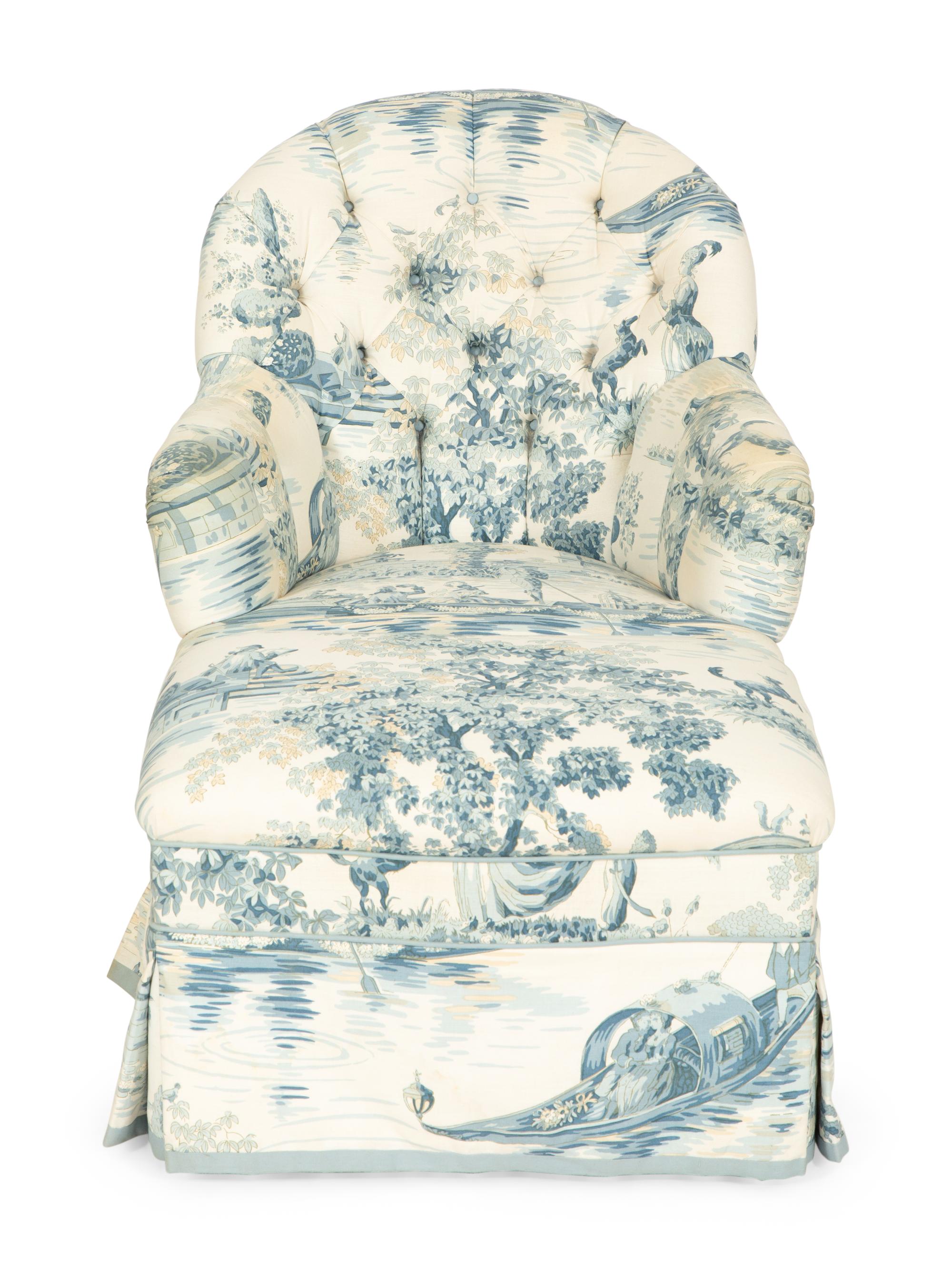 A Blue, White and Cream Upholstered Club Chair and Ottoman