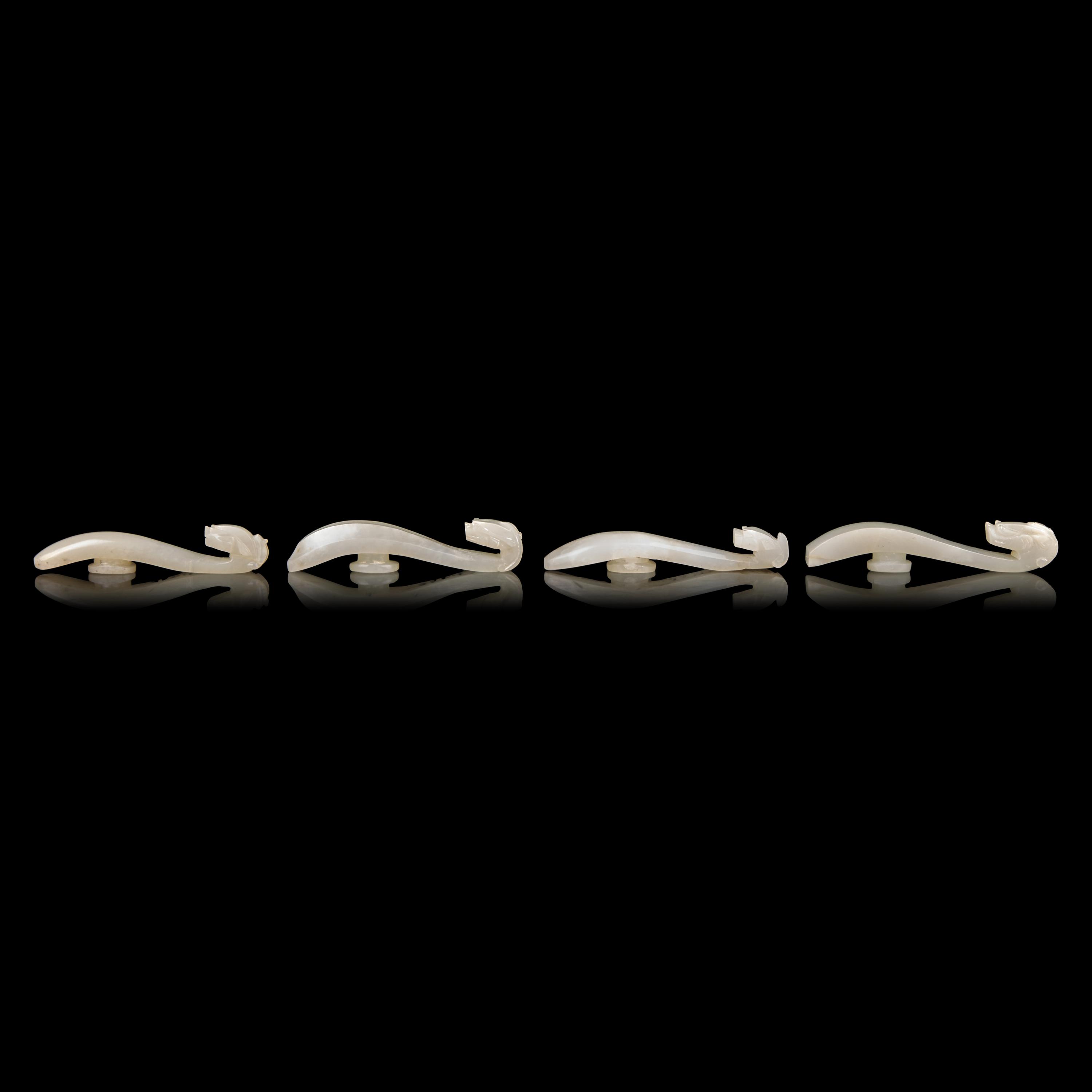 Four Chinese Greyish White Jade "Dragon" Head Belt Hooks, Qing Dynasty — 清 灰白玉龍鉤四件