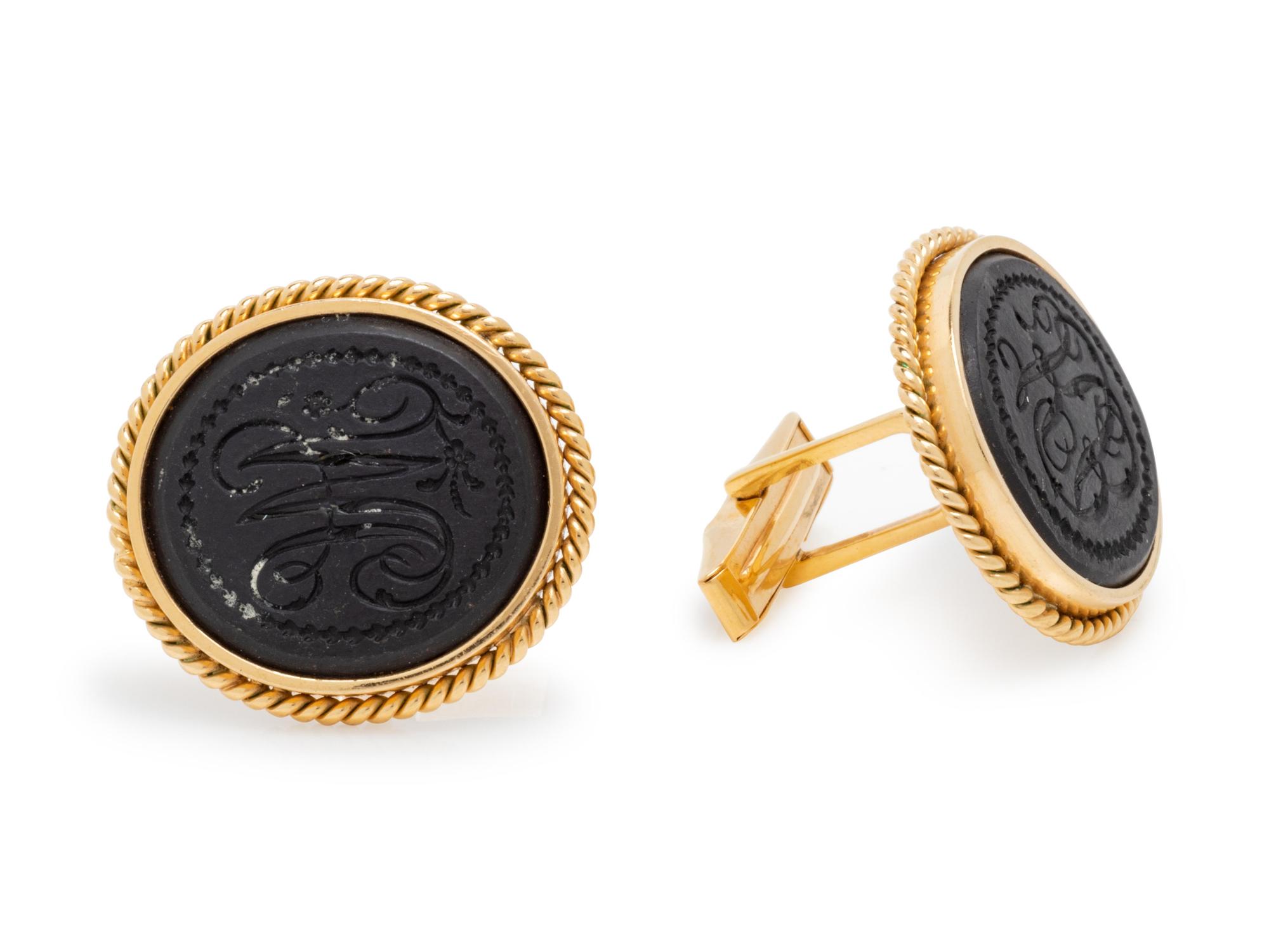 A Pair of 14 Karat Yellow Gold and Carved Hardstone Cufflinks,