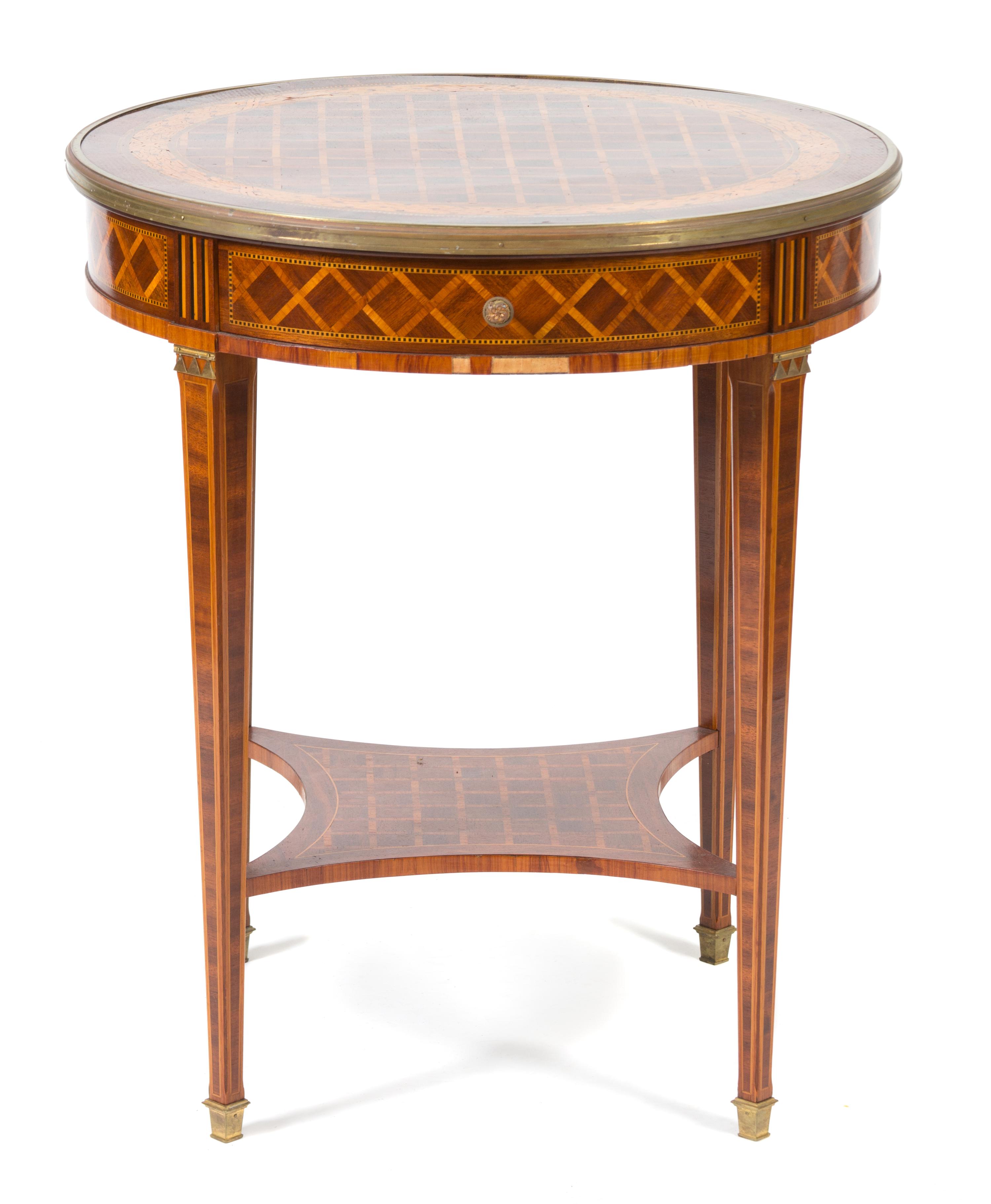 A Louis XVI Style Parquetry Inlaid Gilt Bronze Mounted Gueridon Height 29 1/2 x diameter 25 1/2 inches. — 19TH CENTURY