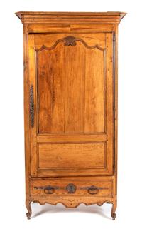 A French Provincial Carved Fruitwood Armoire Height 83 1/2 x width 39 1/2 x depth 24 inches. — 19TH CENTURY