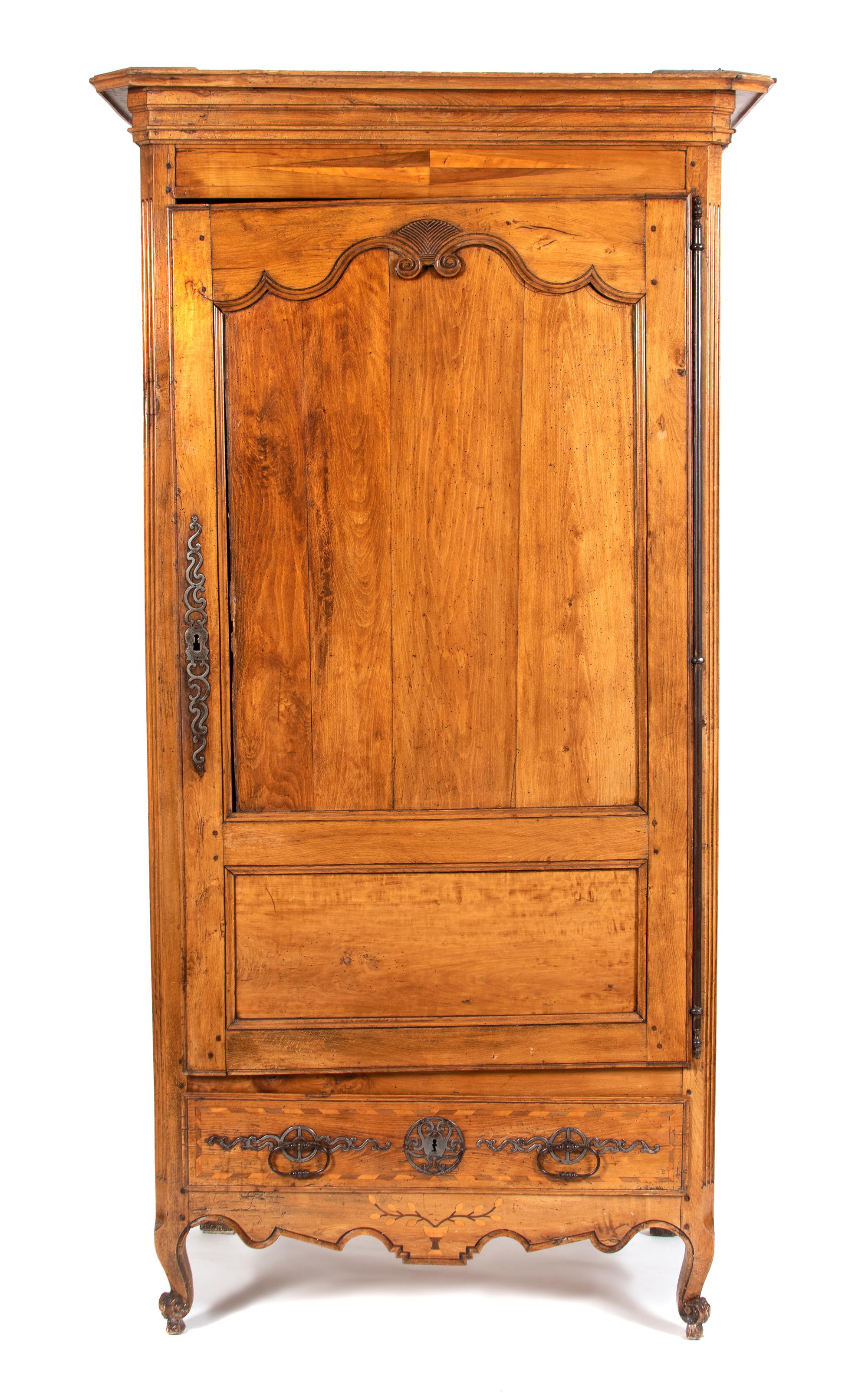 A French Provincial Carved Fruitwood Armoire Height 83 1/2 x width 39 1/2 x depth 24 inches. — 19TH CENTURY