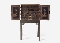 A George III Parcel Gilt Japanned Cabinet on Stand