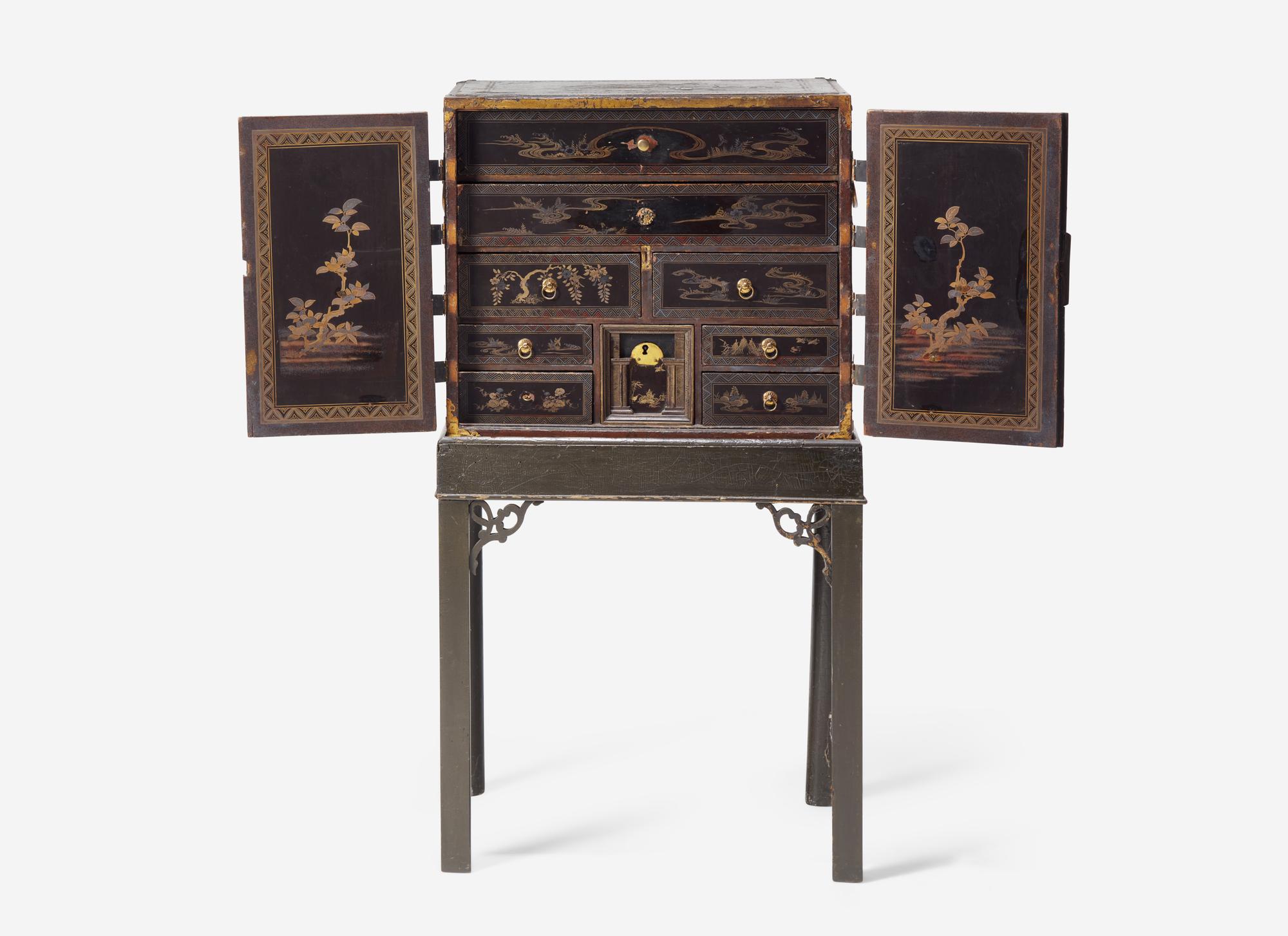 A George III Parcel Gilt Japanned Cabinet on Stand