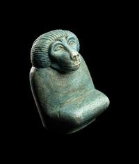 An Egyptian Faience Kneeling Baboon