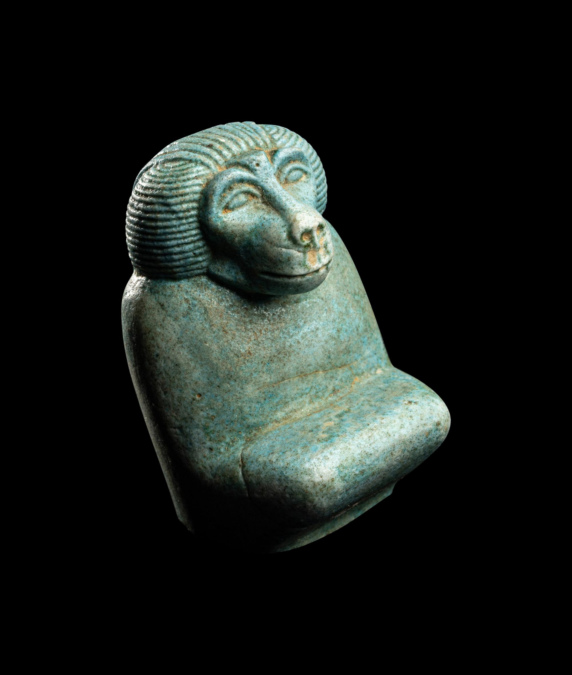 An Egyptian Faience Kneeling Baboon