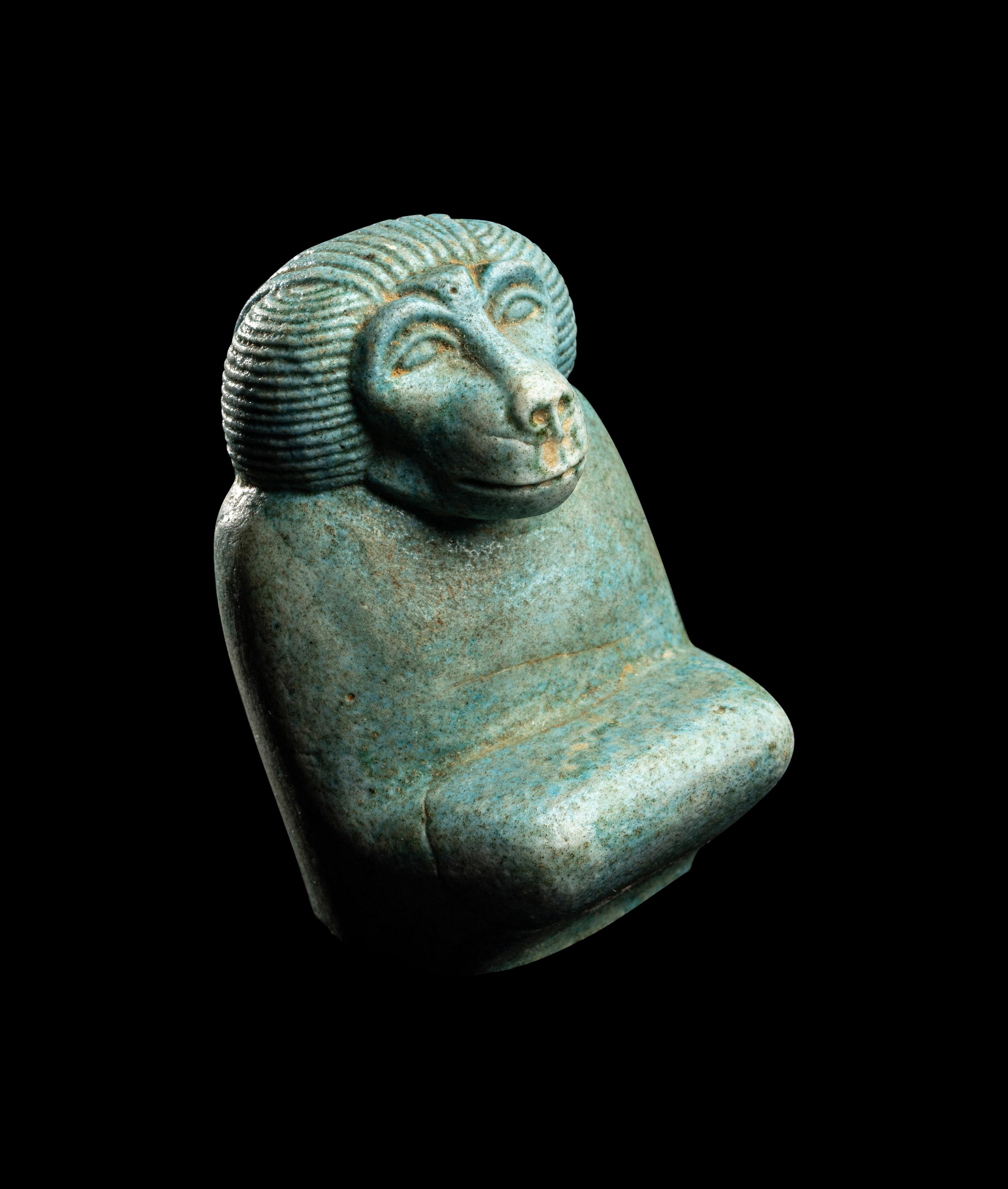 An Egyptian Faience Kneeling Baboon