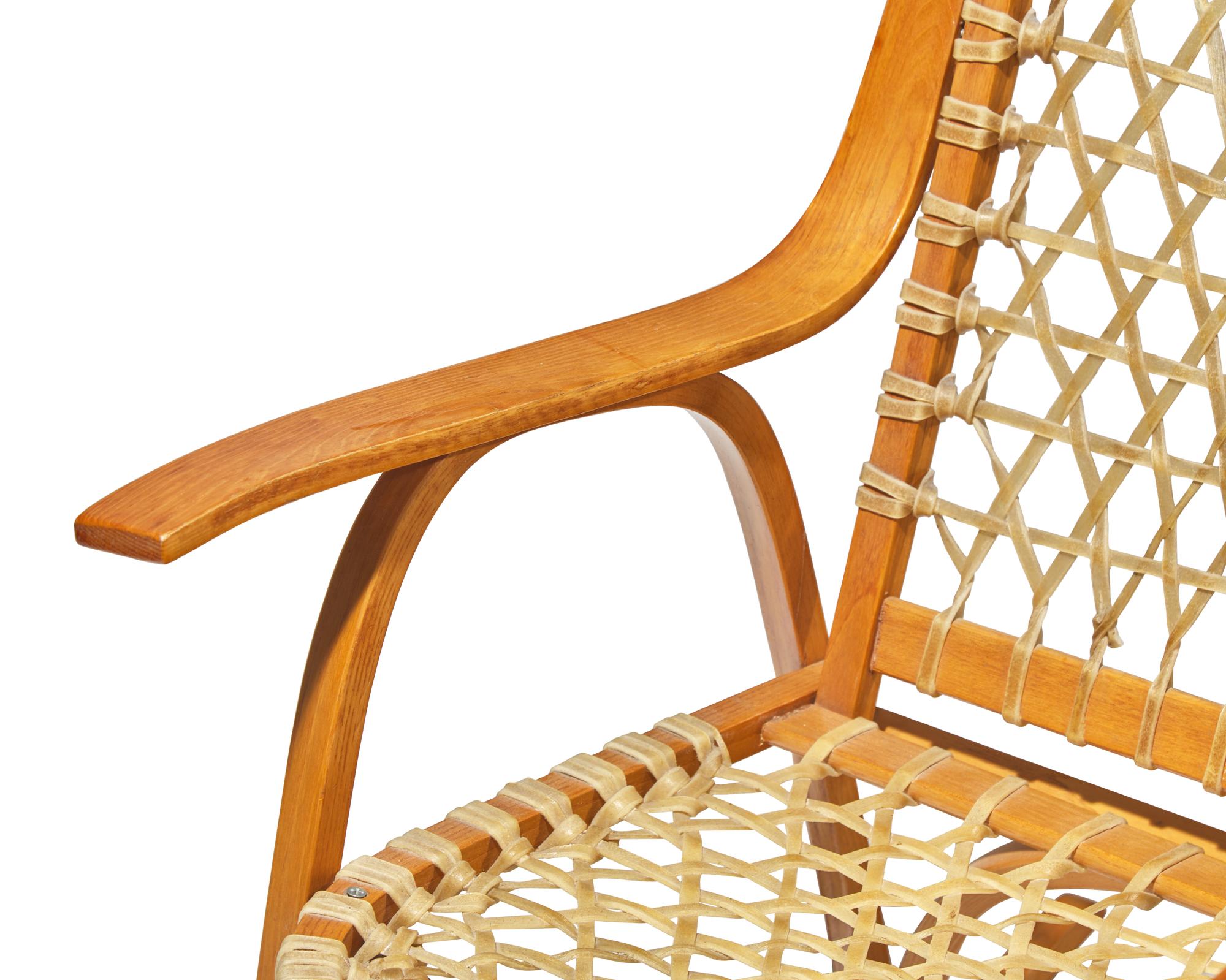 A Pair of Lacquered Fruitwood and Rawhide 'Snowshoe' Rocking Chairs