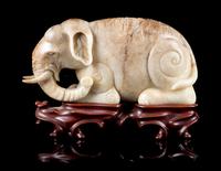 A Mottled Jade Figure of an Elephant Length 7 inches.