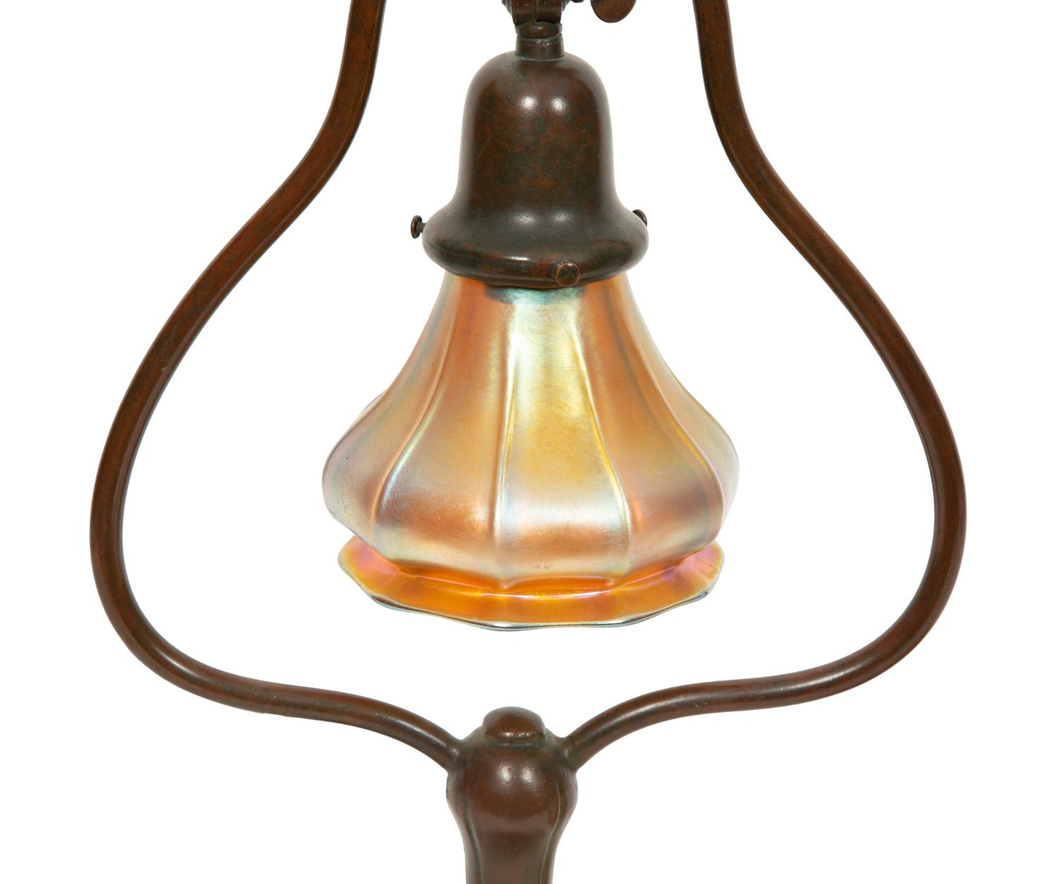 A Handel Bronze Desk Lamp and Two Steuben Aurene Glass Shades