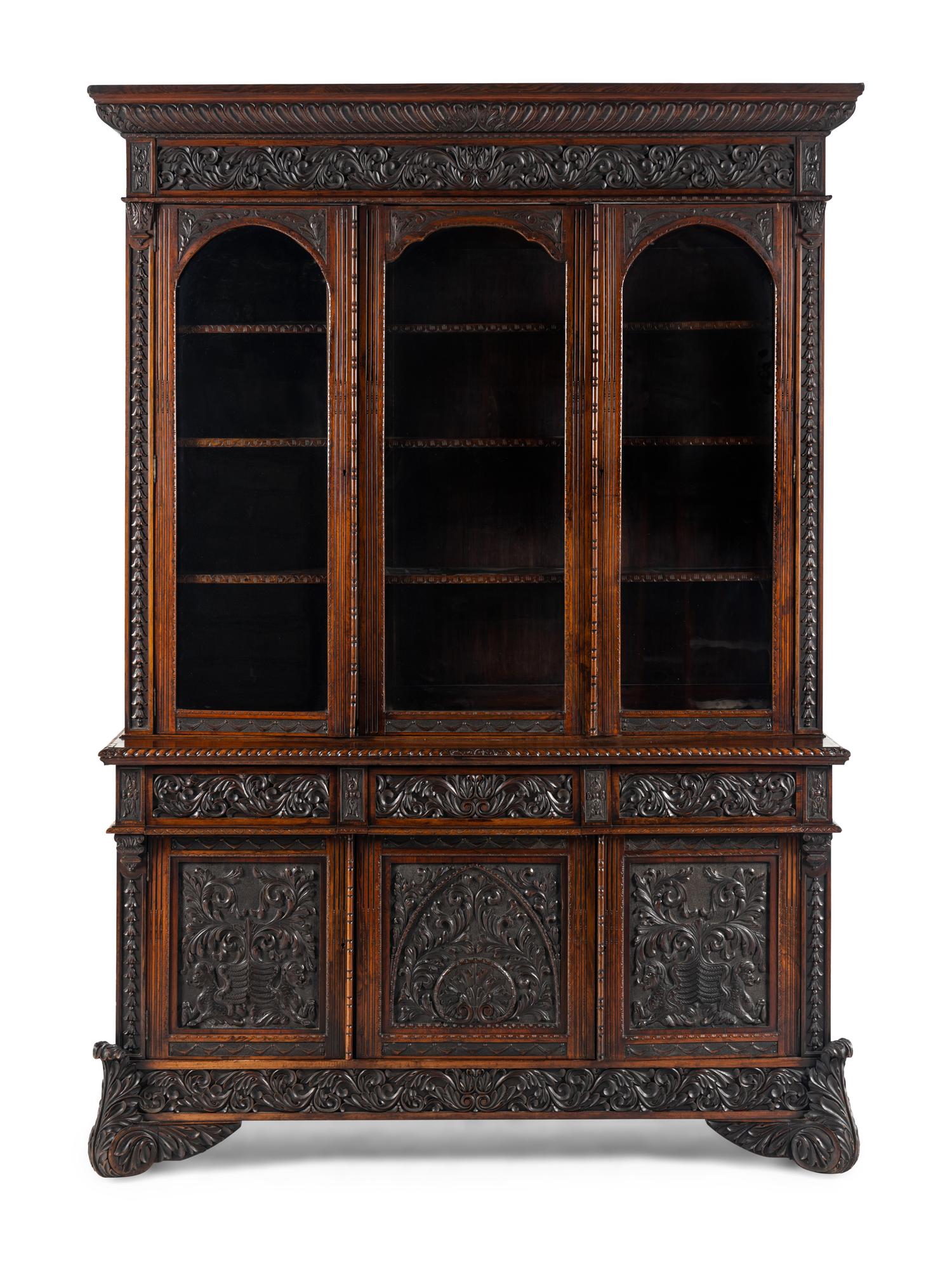 An Italian Rosewood and Carved Walnut Bookcase