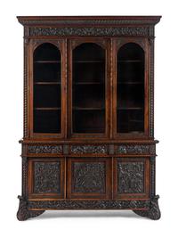 An Italian Rosewood and Carved Walnut Bookcase