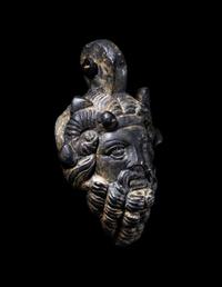A Roman Bronze Zeus-Ammon Applique