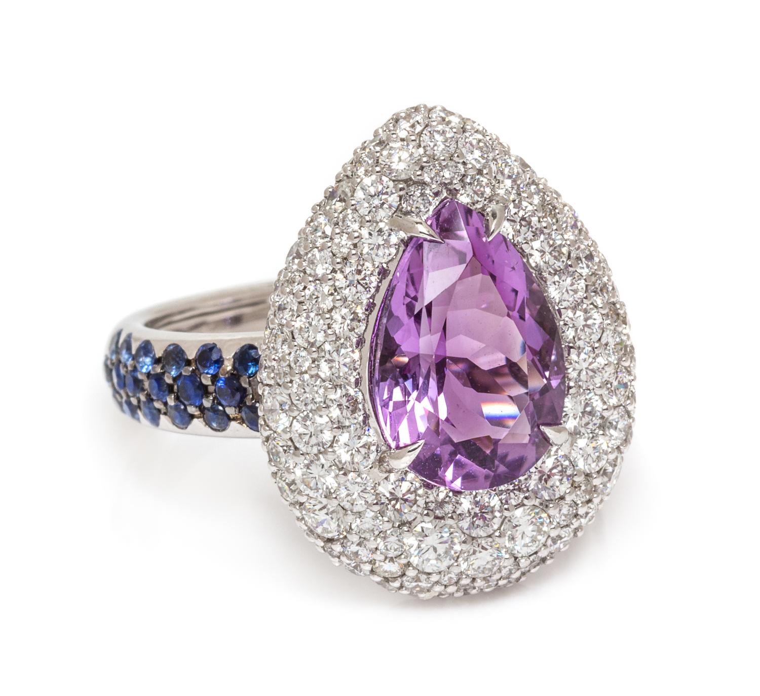 An 18 Karat White Gold, Amethyst, Diamond and Sapphire Ring, 7.40 dwts.