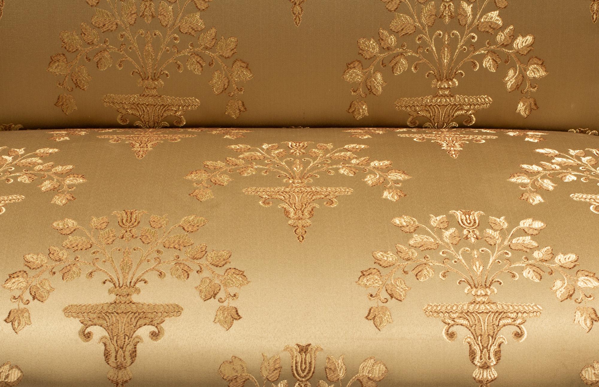 A Pair of Louis XV Style Painted and Parcel Gilt Settees