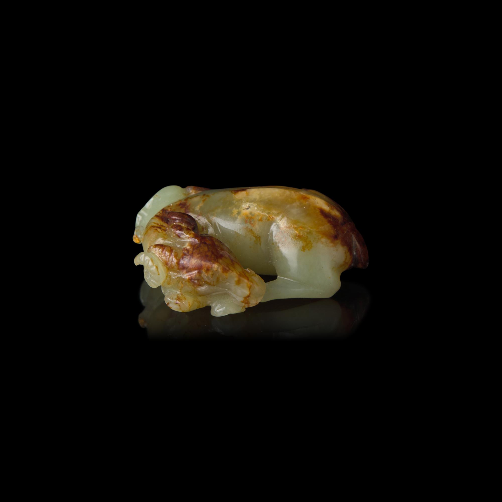 A Small Chinese Celadon Jade Goat, Qing Dynasty or Earlier 清或更早 青玉臥羊把件