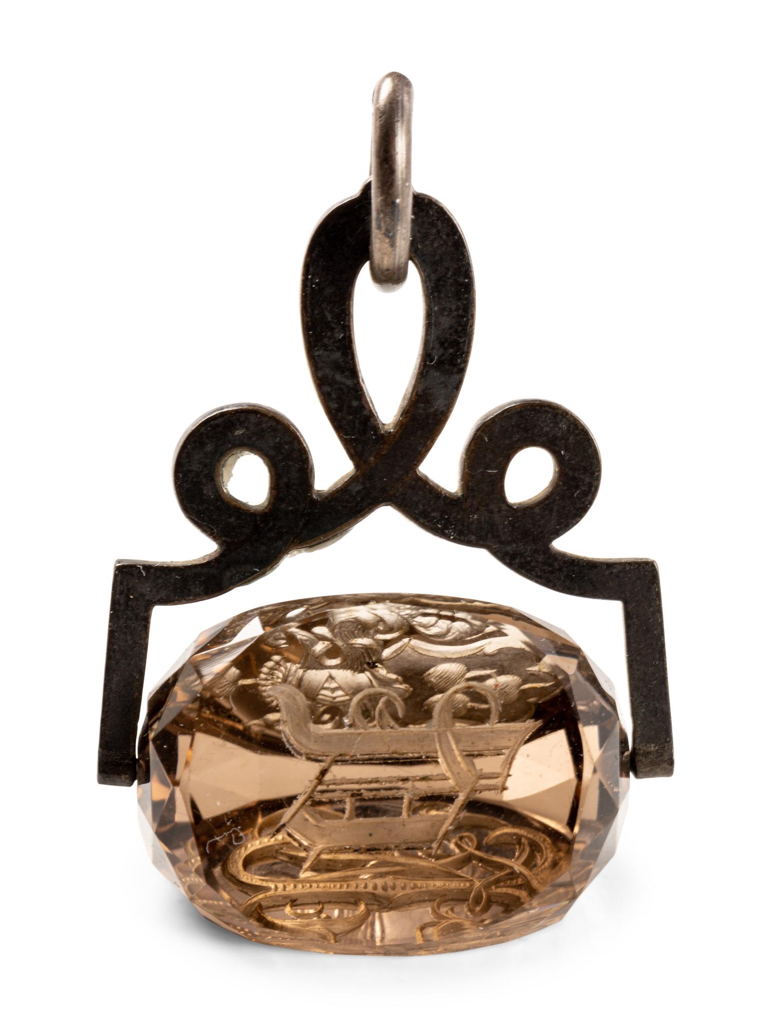 A German Carved Topaz and Gilt Metal Mounted Hand Seal