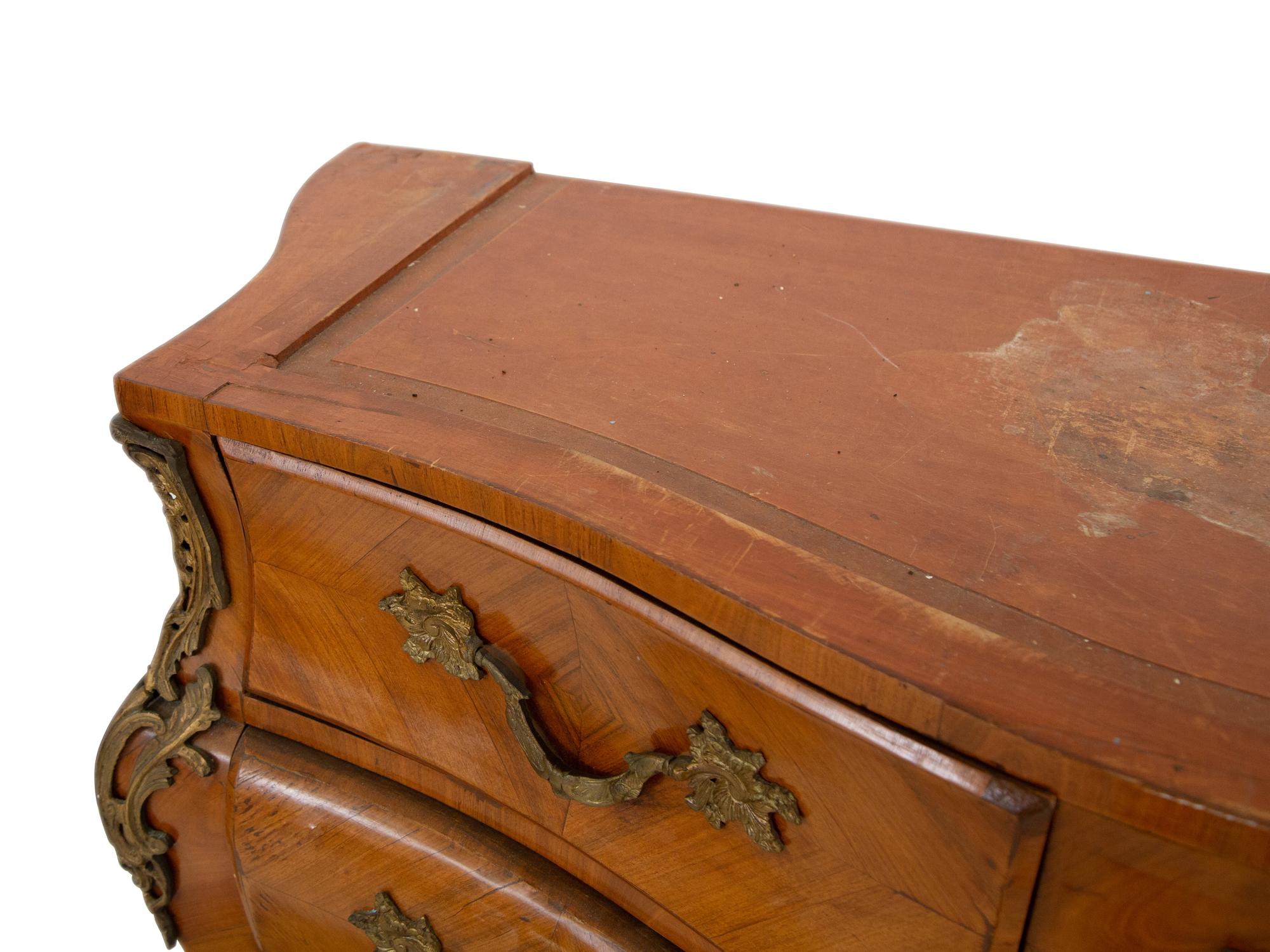 A Pair of Gilt Bronze Mounted Kingwood Bombe Commodes