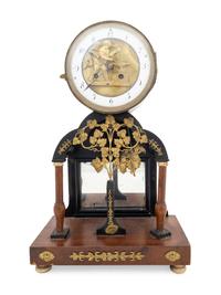 An Empire Gilt Metal Mounted Walnut Mantel Clock