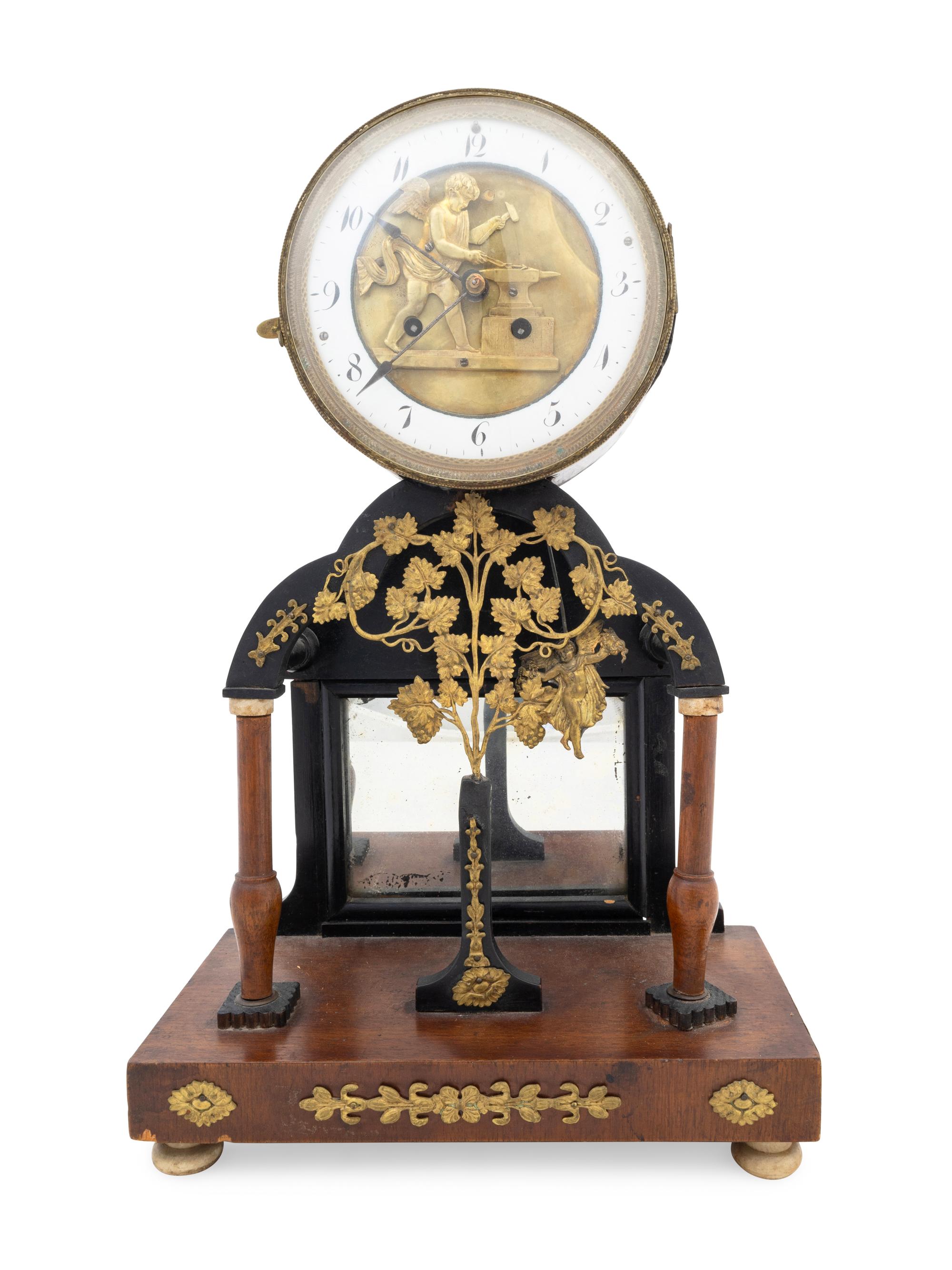 An Empire Gilt Metal Mounted Walnut Mantel Clock