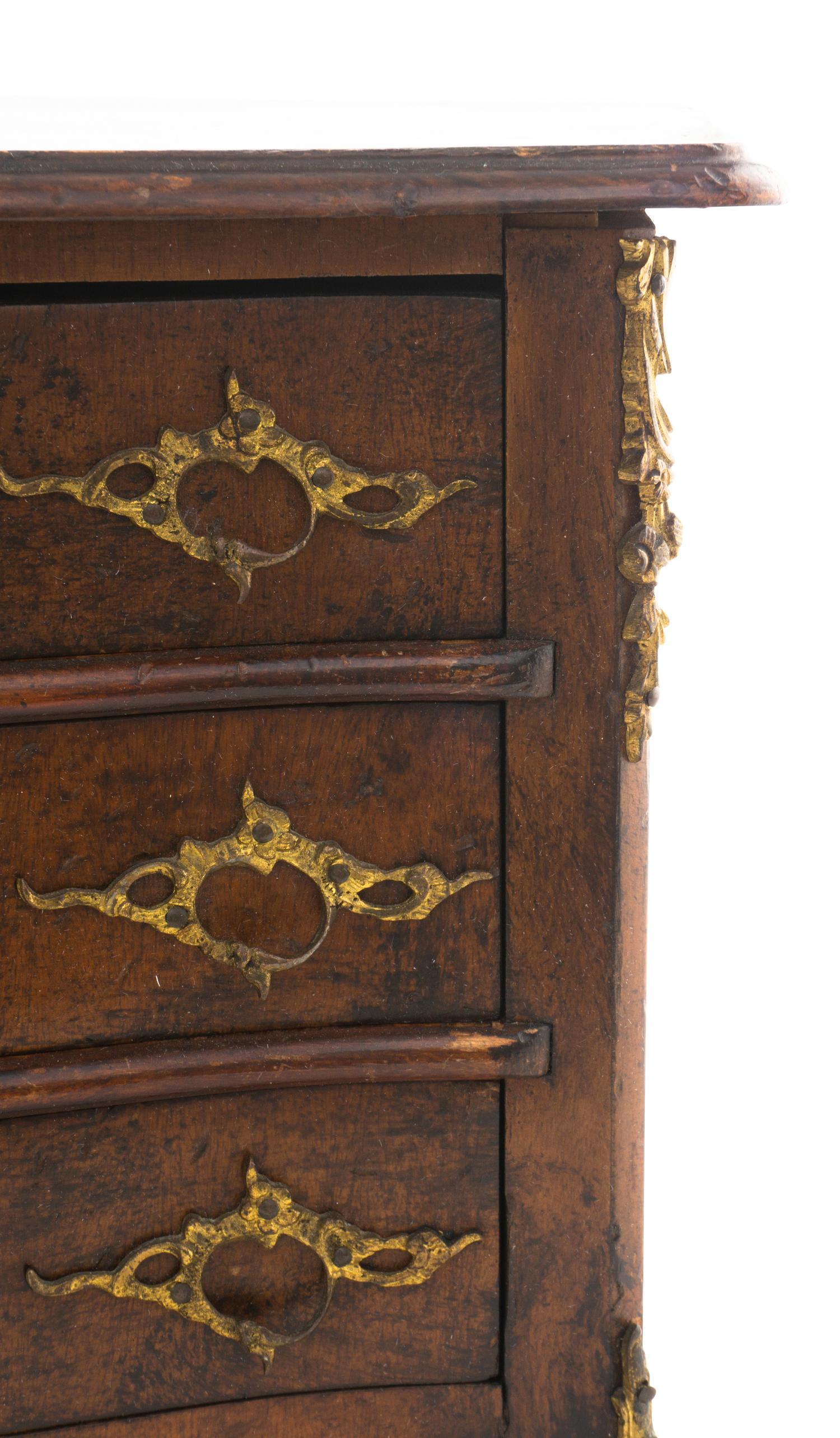 A Louis XV Style Walnut Diminutive Commode