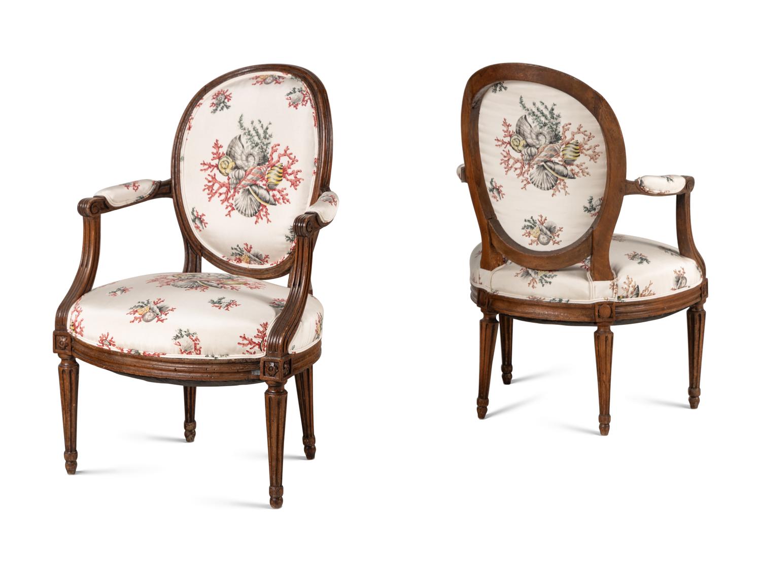 A Pair of Louis XVI Walnut Fauteuils