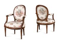A Pair of Louis XVI Walnut Fauteuils