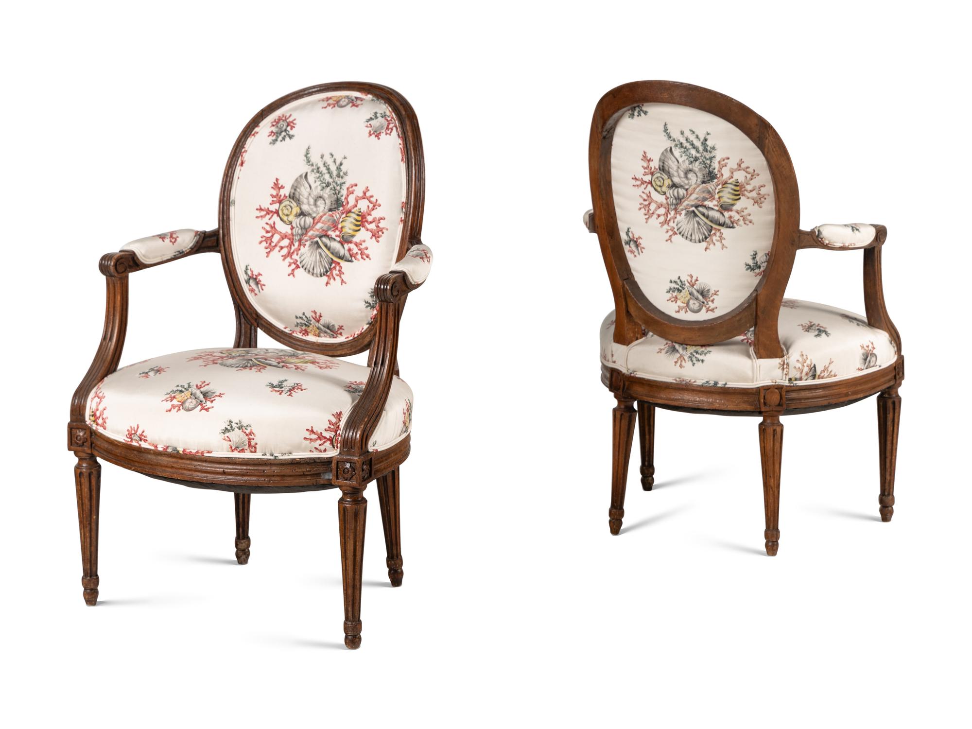 A Pair of Louis XVI Walnut Fauteuils