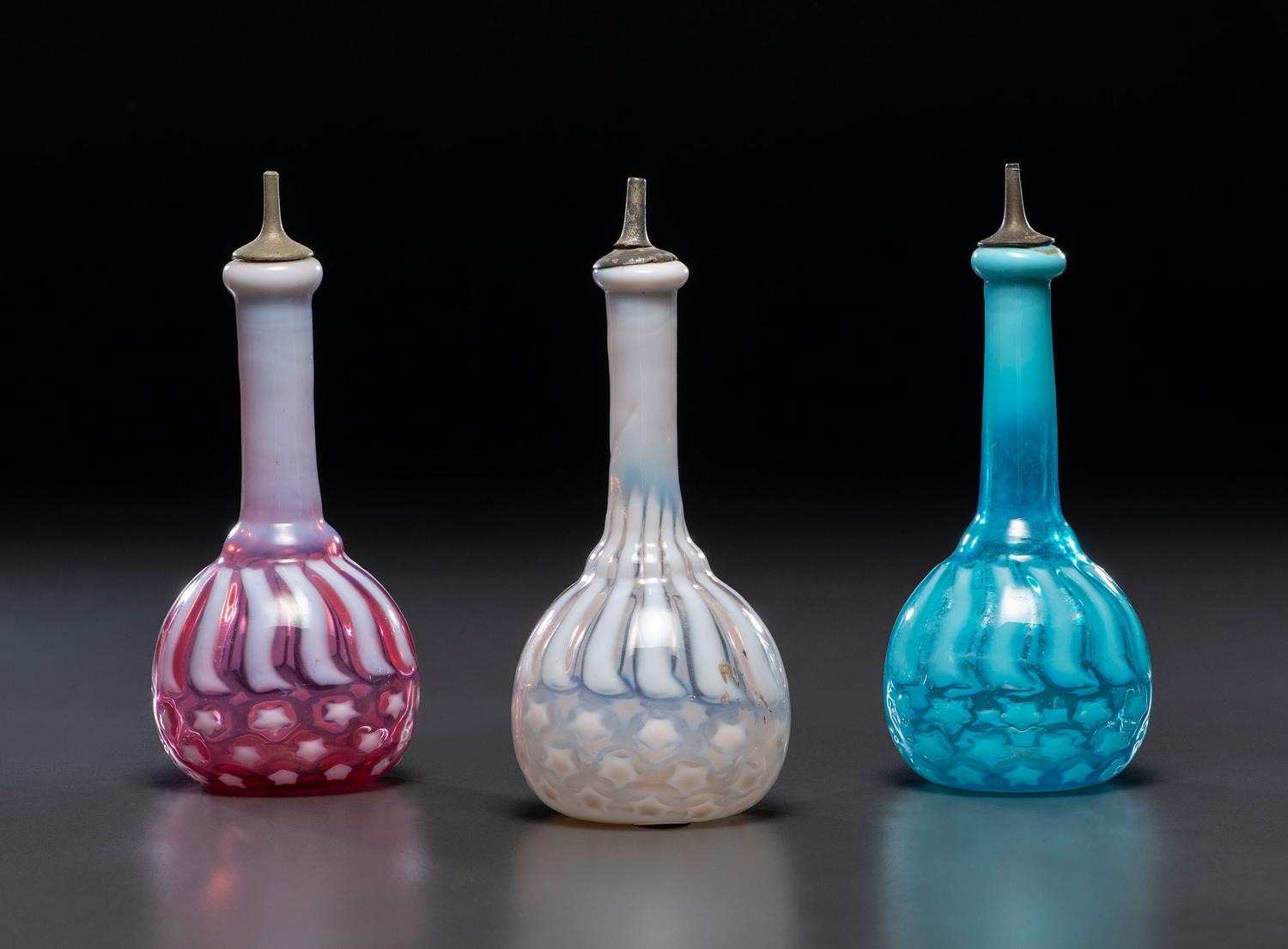 Three 'Stars and Stripes' Opalescent Glass Barber Bottles