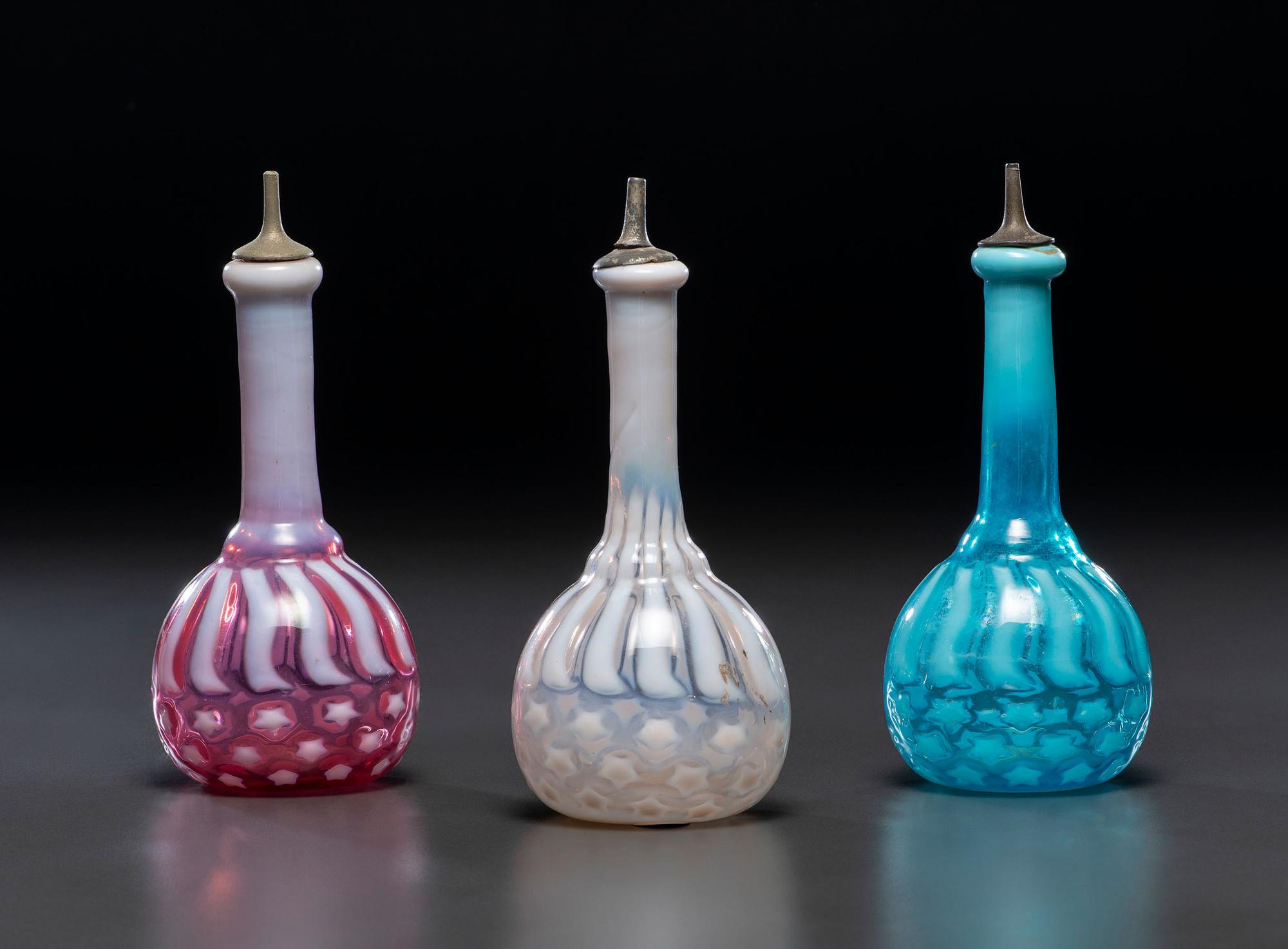 Three 'Stars and Stripes' Opalescent Glass Barber Bottles