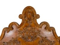 A Spanish Colonial Style Carved Walnut Bed with headboard