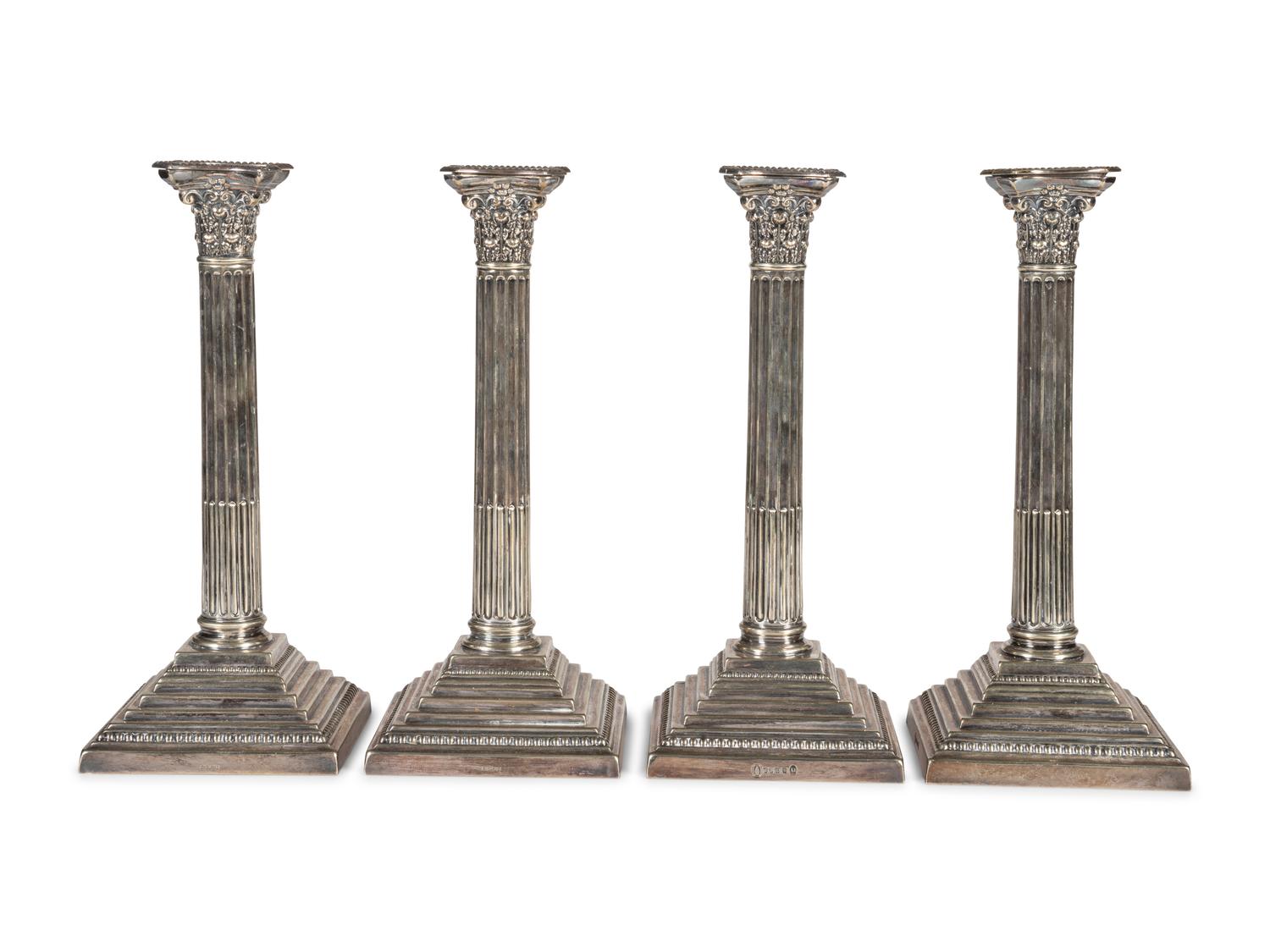 A Set of Four English Silver-Plate Candlesticks