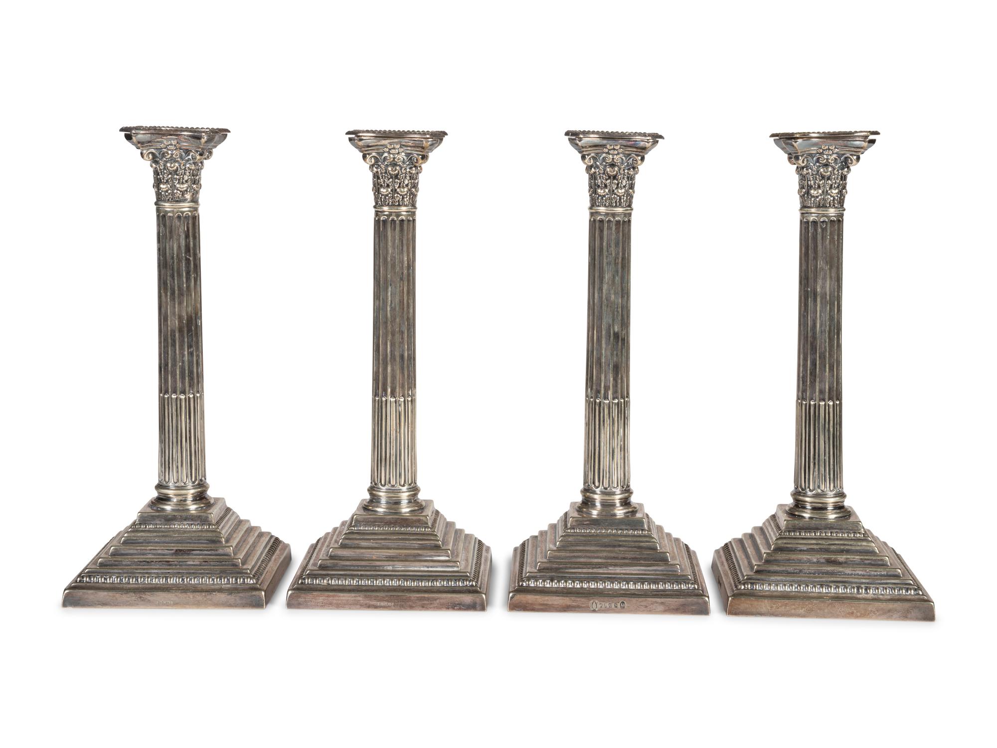 A Set of Four English Silver-Plate Candlesticks