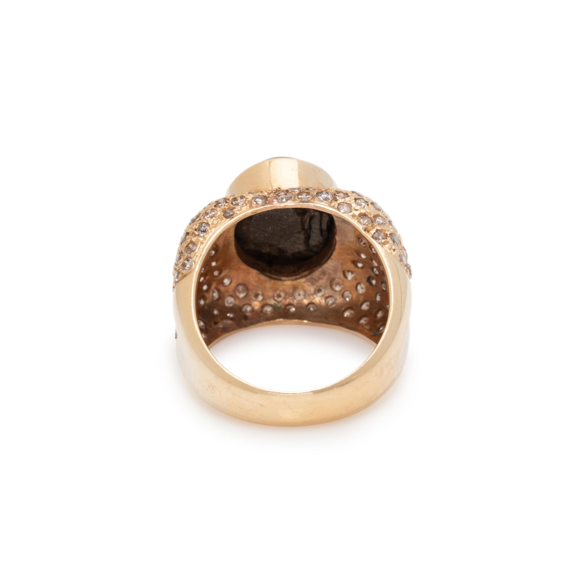 BLACK STAR SAPPHIRE, DIAMOND, AND YELLOW GOLD RING