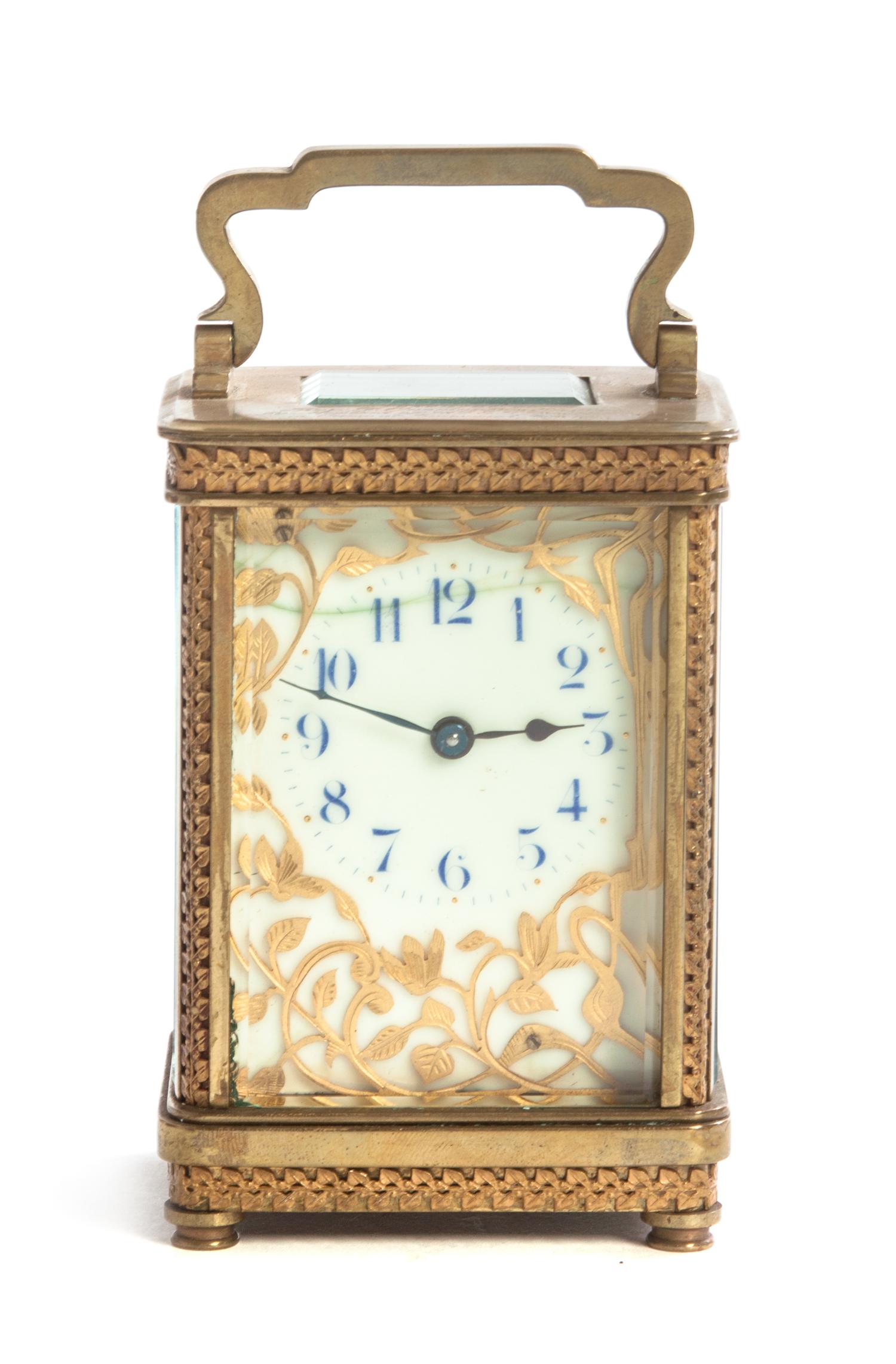 A French Gilt Bronze and Glass Carriage Clock, Height 5 5/8 inches.