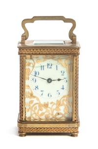 A French Gilt Bronze and Glass Carriage Clock, Height 5 5/8 inches.