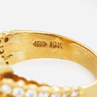An 18K Yellow Gold, Diamond, and Opal Ring
