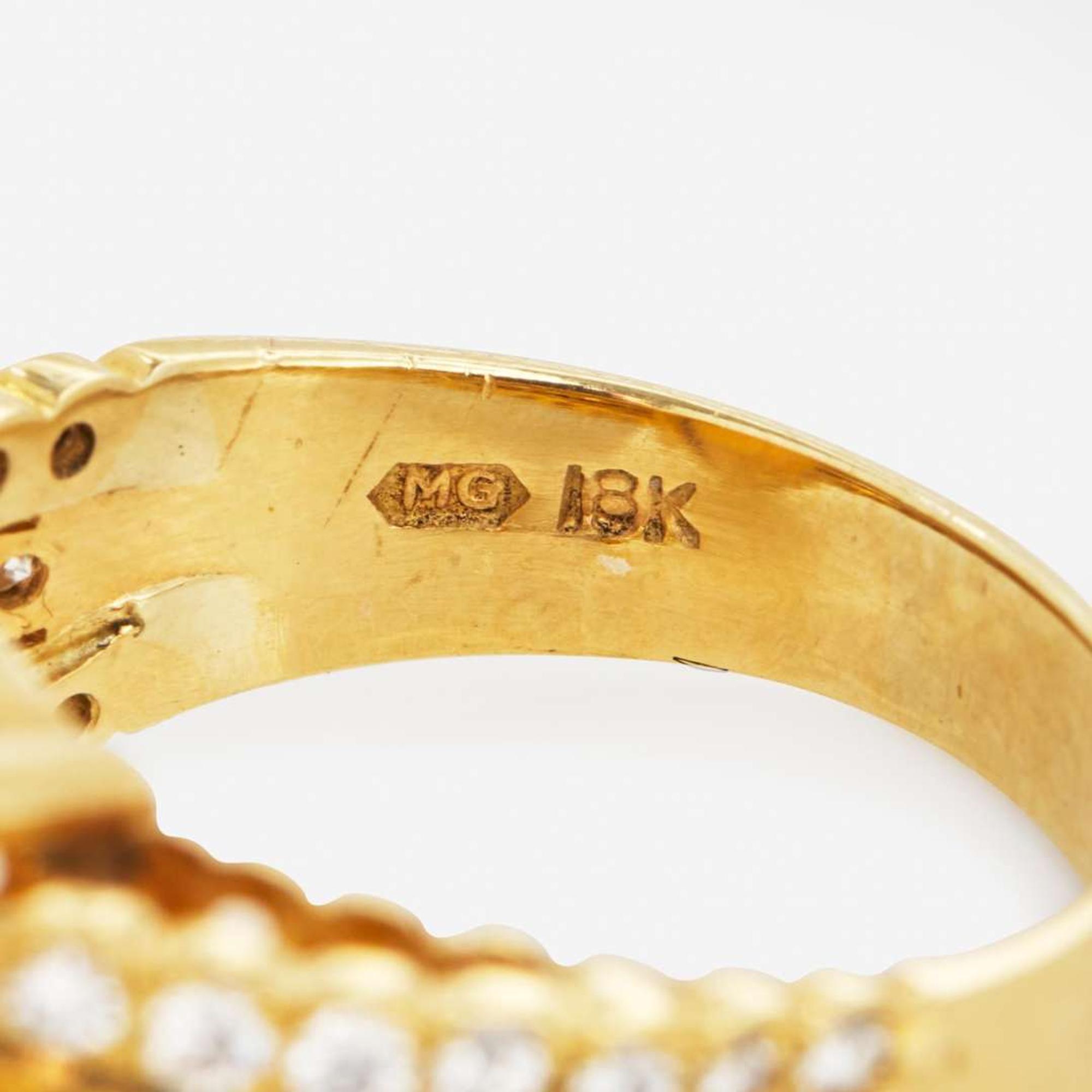 An 18K Yellow Gold, Diamond, and Opal Ring