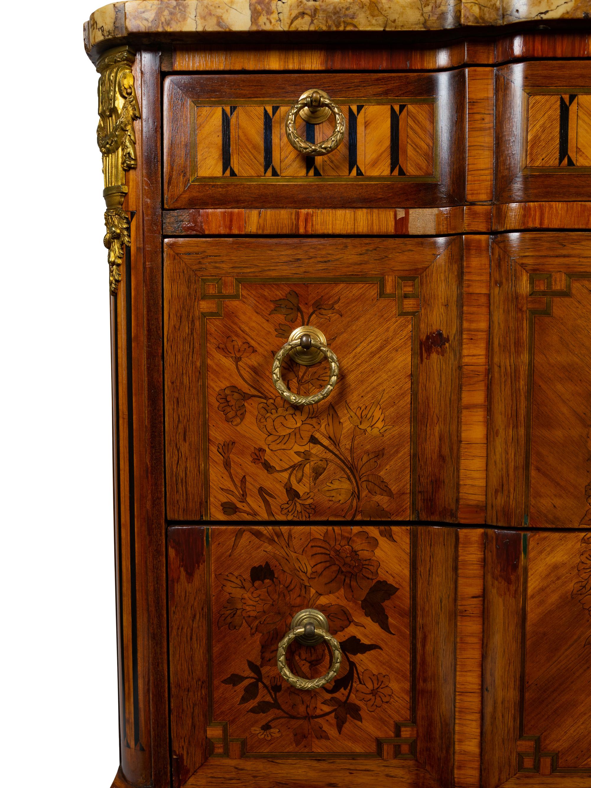 A Louis XV/XVI Transitional Style Marquetry Marble-Top Commode