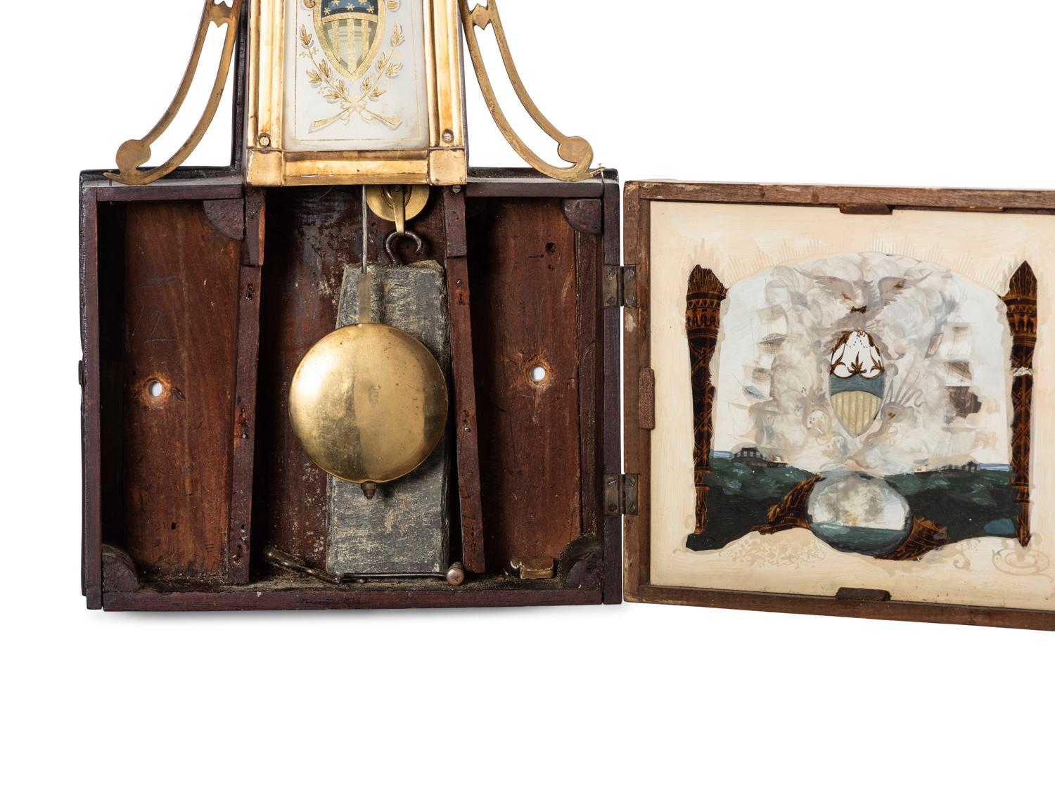 A Classical Eglomise Panel Inset Parcel-Gilt Decorated Mahogany USS Constitution Wall Clock