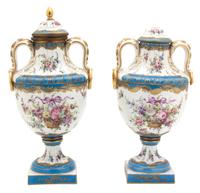 A Pair of French Sevres Gilt Bronze Mounted Lidded Urns Height 15 inches. — 19TH CENTURY
