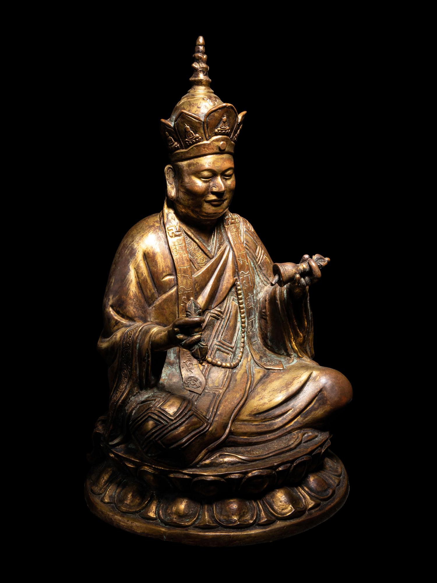 A Tibetan Gilt Bronze Figure of a Seated Guru