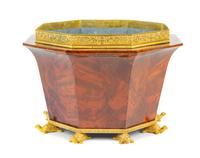 An Empire Style Gilt Bronze Mounted Mahogany Jardiniere Height 13 x width 19 3/4 inches. — 19TH CENTURY