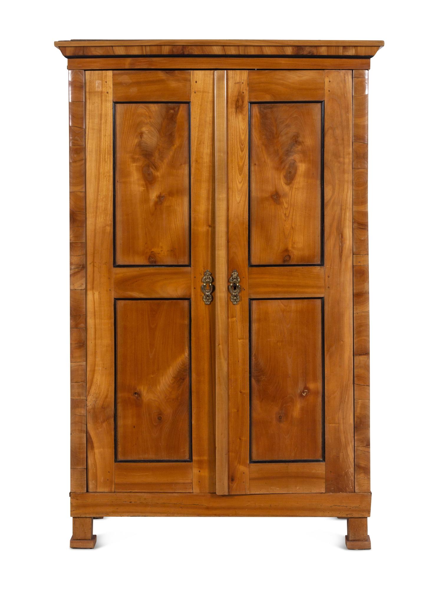 A Biedermeier Parcel Ebonized Birch Armoire