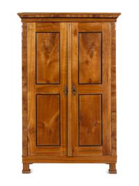 A Biedermeier Parcel Ebonized Birch Armoire