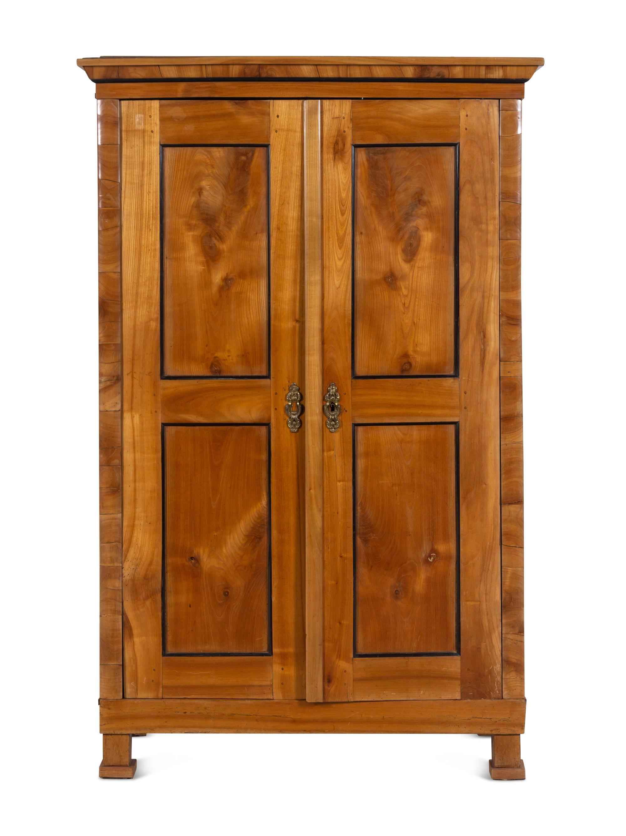 A Biedermeier Parcel Ebonized Birch Armoire